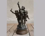 Bronze de trois angelots tenant des torches. Le prix du régule au kilo est une donnée importante pour estimer la valeur de cette sculpture.