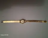 Montre LIP dorée, bracelet métallique, cadran rond avec chiffres romains. Une belle pièce de valeur, montre LIP numérotée.