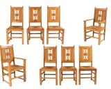 Ensemble de chaises en bois clair, style Charles Dudouyt, avec assises en paille tressée et dossiers ornés de motifs géométriques.