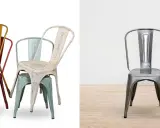 Empilement de chaises en métal colorées, style industriel, rappelant l'héritage de tolix la manufacture. Une chaise argentée se tient seule sur un parquet.