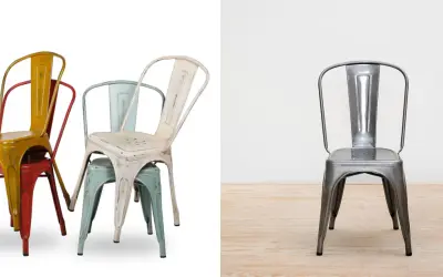 Empilement de chaises en métal colorées, style industriel, rappelant l'héritage de tolix la manufacture. Une chaise argentée se tient seule sur un parquet.