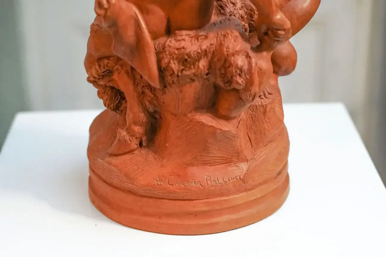 D&eacute;tail d'une sculpture en terre cuite sign&eacute;e A. Carrier-Belleuse, repr&eacute;sentant une sc&egrave;ne mythologique.